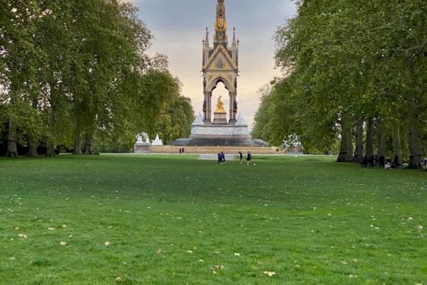 The Albert Memorial in Kensington Garden surrounded by green lawns and manicured trees in London, England, UK