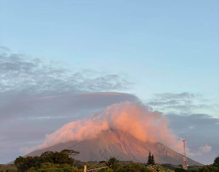 Distant view of smoking Masaya Volcano with a beautiful sky behind it in Nicaragua