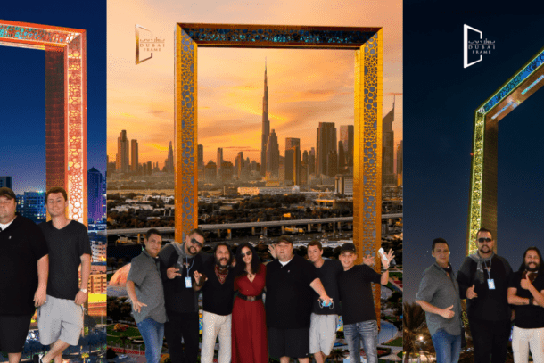 Group of friends standing in front of a giant gold frame that frames the city skyline in dubai