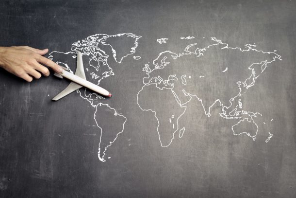 Toy airplane on a chalkboard map