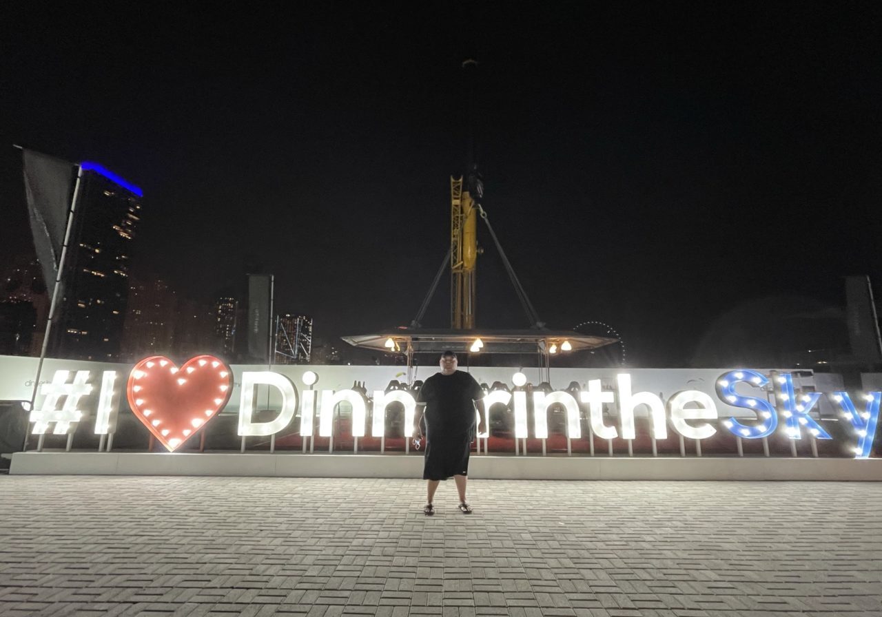 Lit up sign of the Dinner in the Sky attraction in Dubai