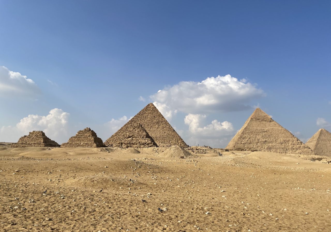 Ancient Pyramids Of Egyptian Desert Ancient Egyptian pyramids and sunny blue skies in the sandy desert of Egypt
