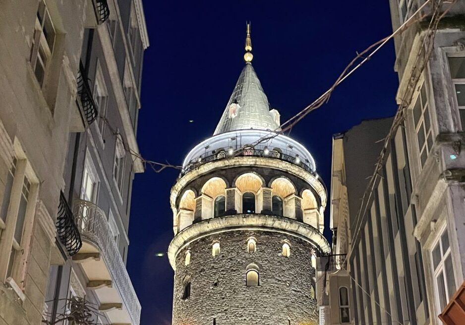 Illuminated Galata Tower Of Istanbul Amazing close up ground view of the illuminated Galata Tower at night in Istanbul, Turkey